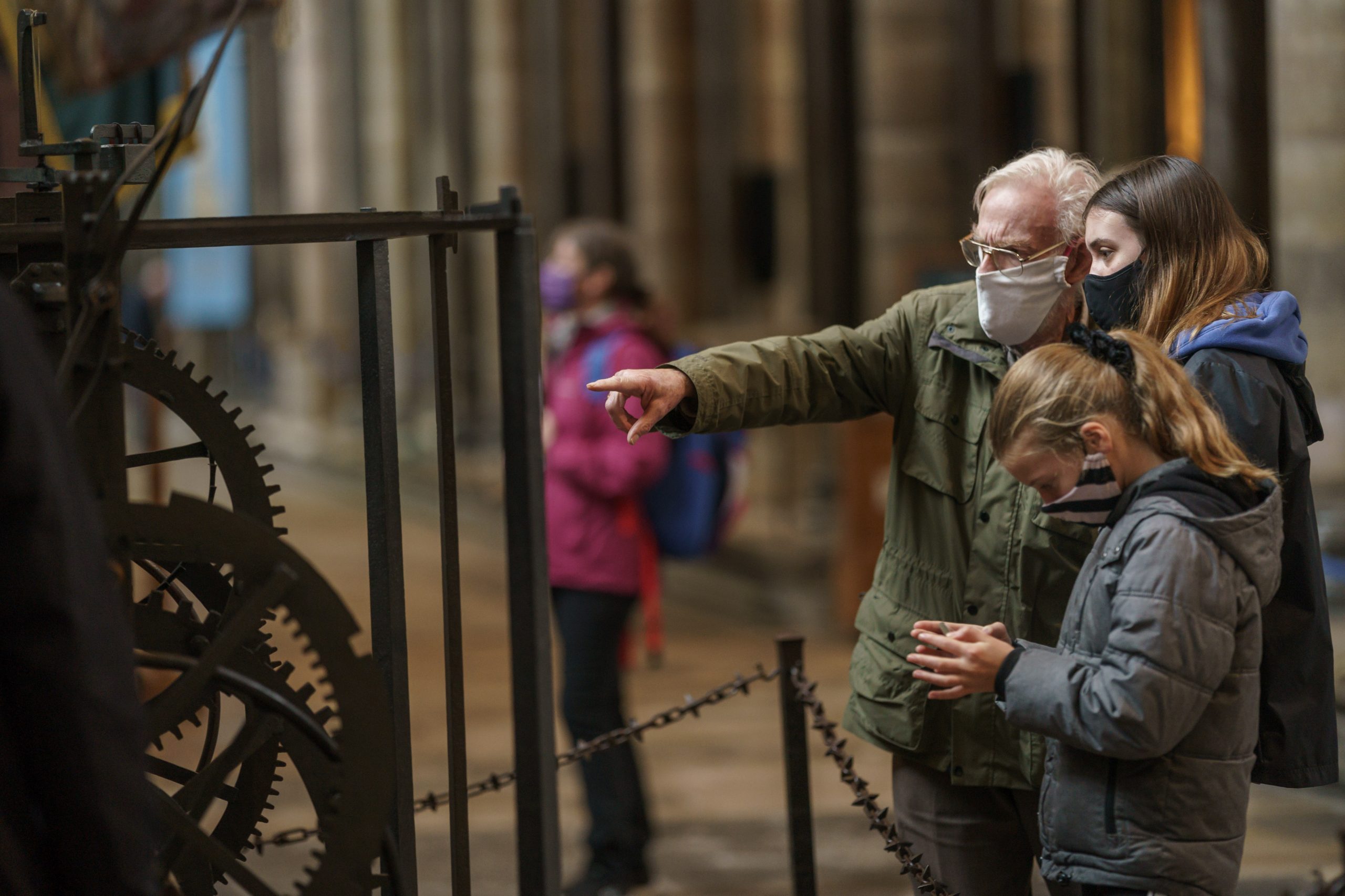 Visitors of Salisbury Cathedral discovering the oldest working clock