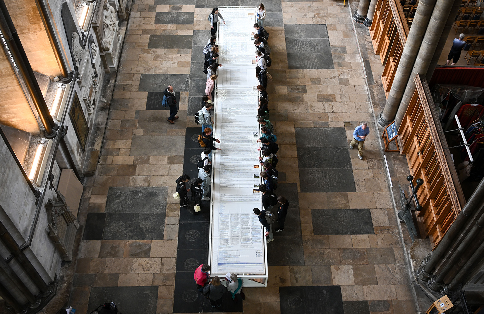 Visitors looking at Cornelia Parker's Magna Carta (An Embroidery)