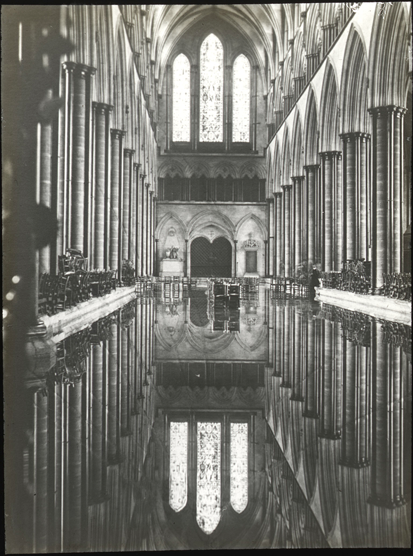 Black and white photo showing a flooded nave inside Salisbury Cathedral