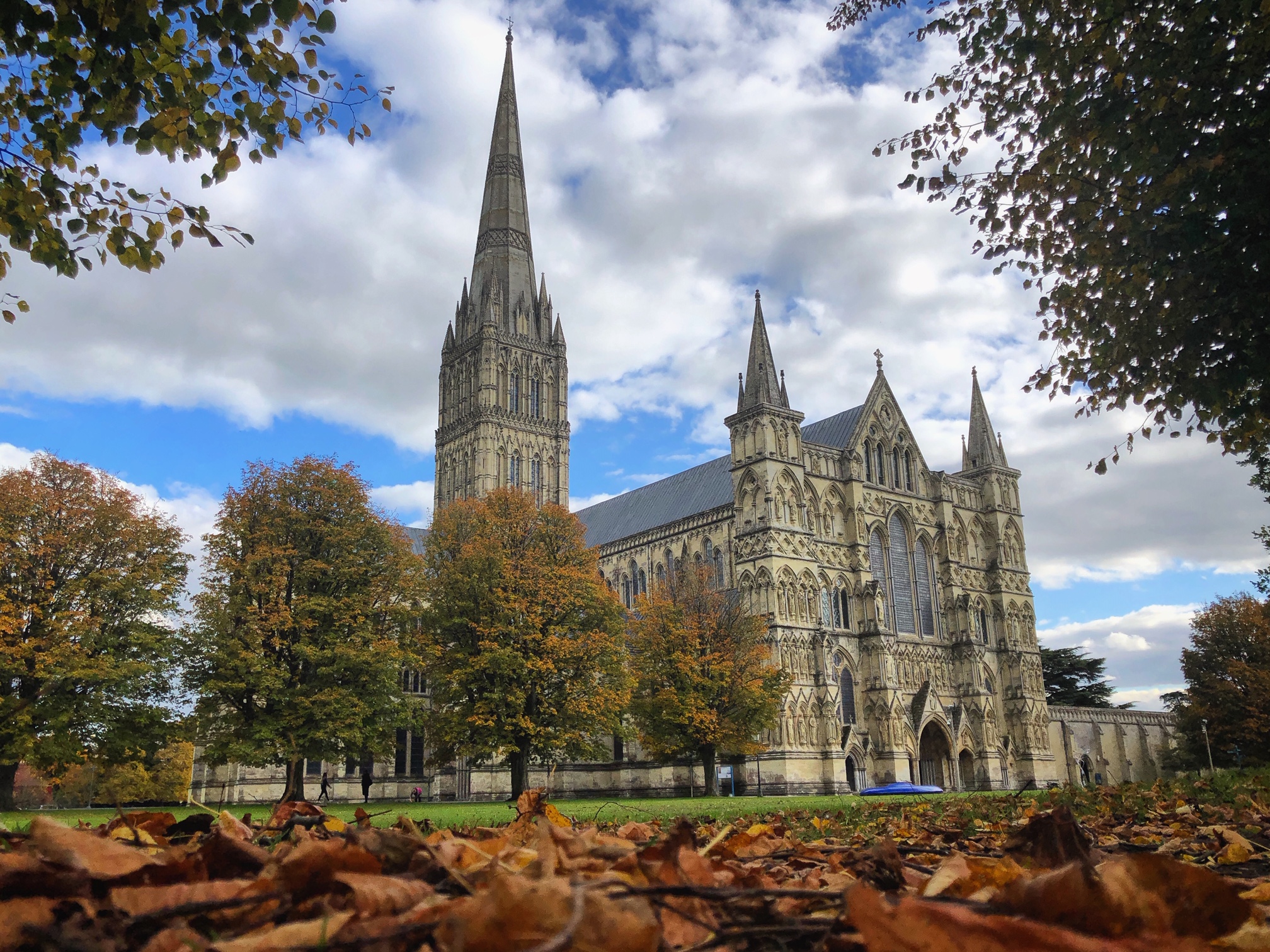 Cathedral exterior in autumn with fallen leaves on the ground