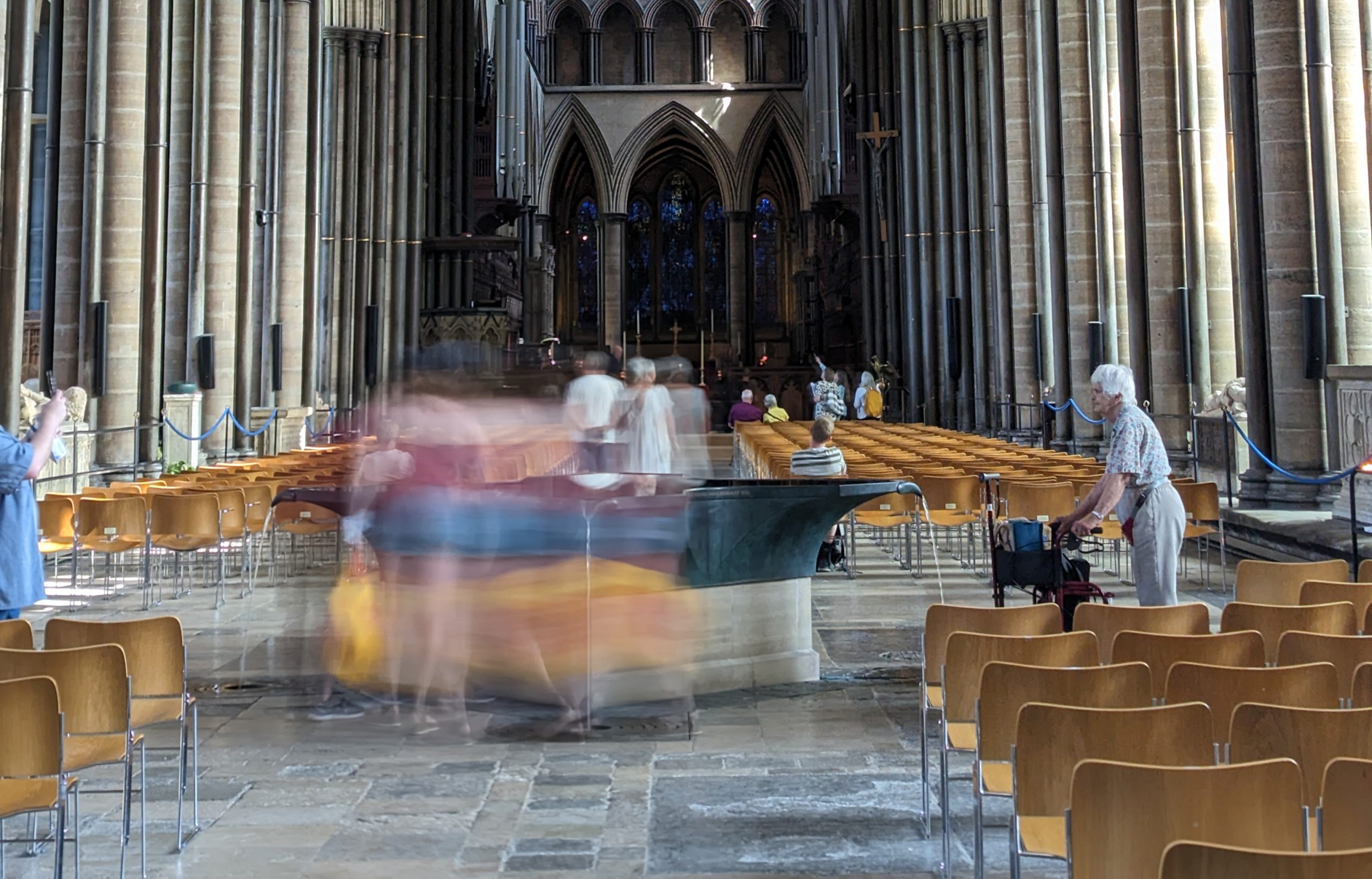 Motion blurred photo of visitors inside Salisbury Cathedral
