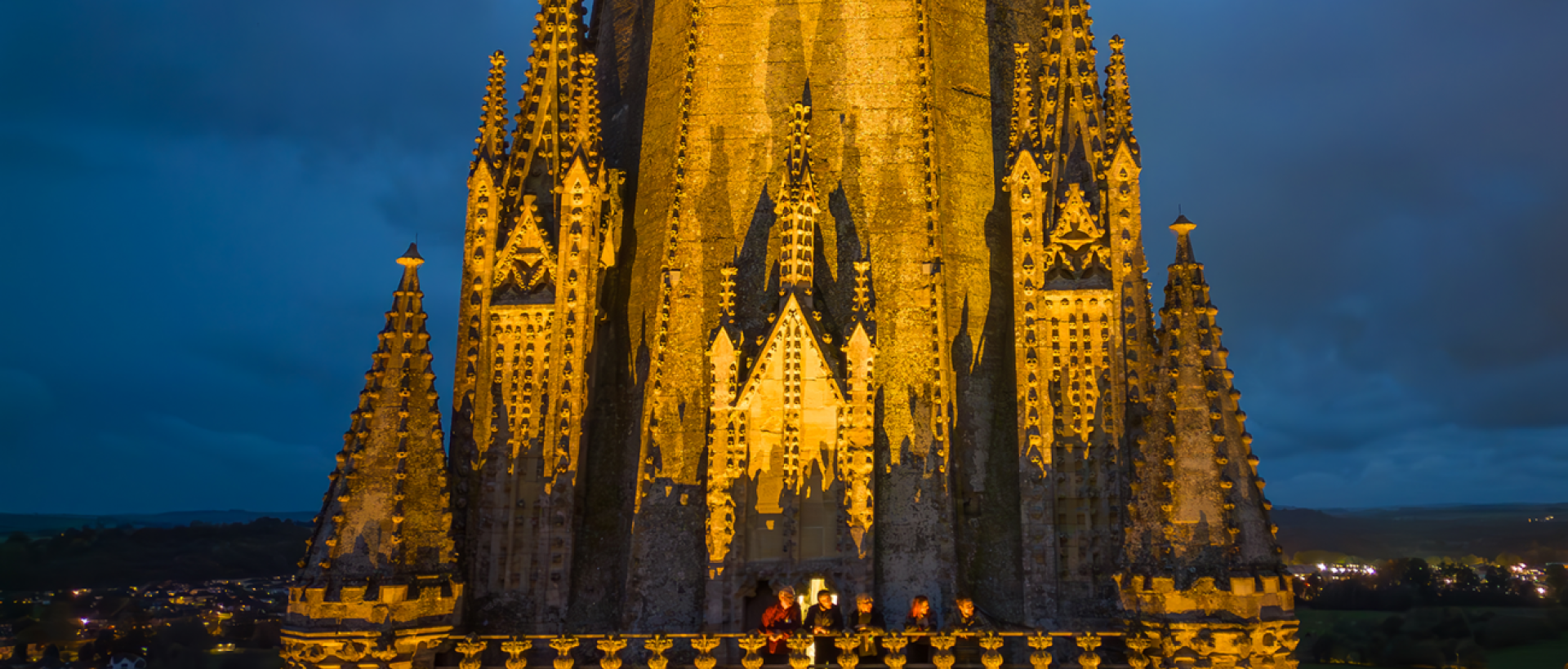 The Cathedral tower balcony after dark with a group of visitors