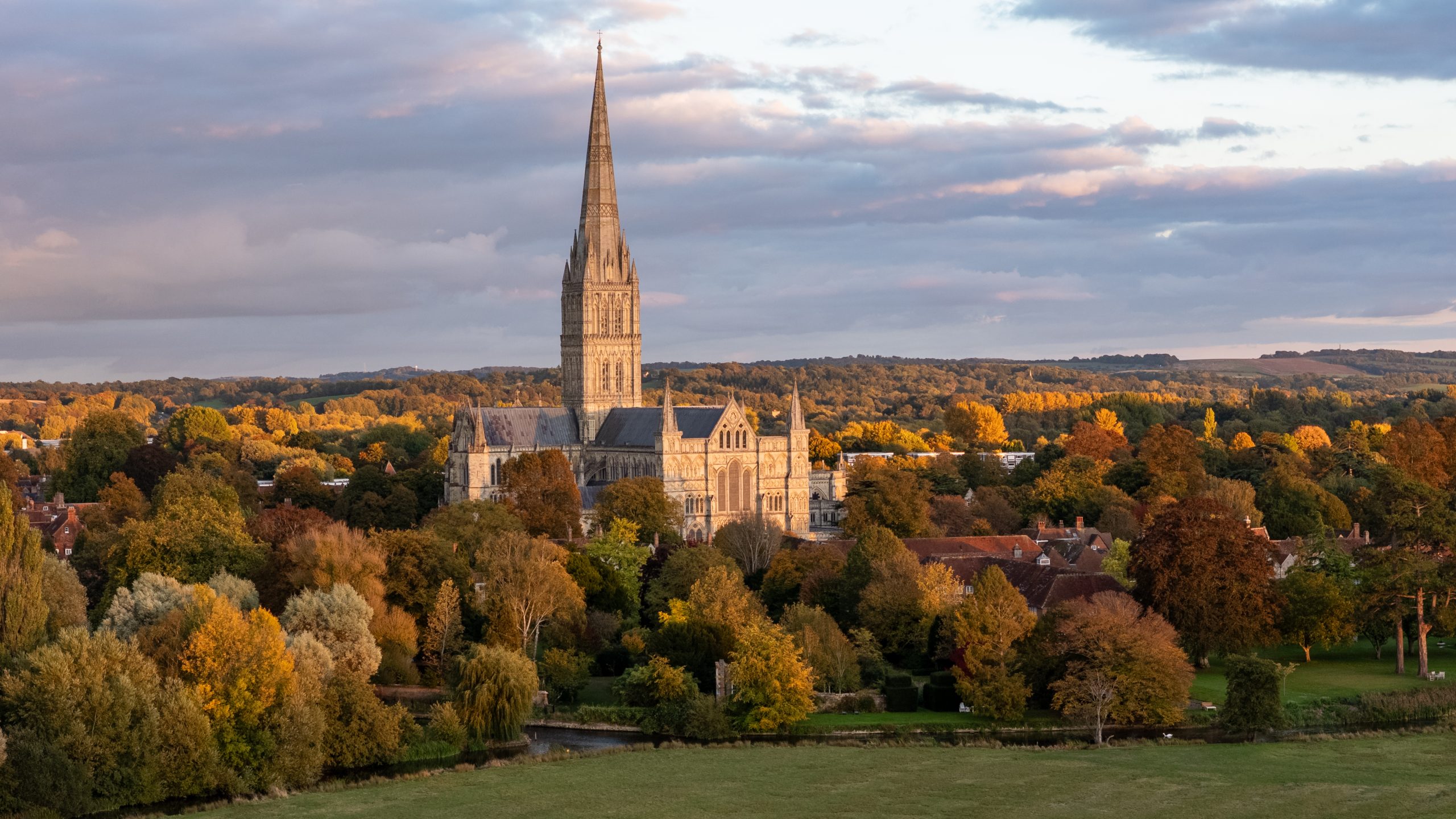 A wide view of the cathedral amongst the autumnal trees