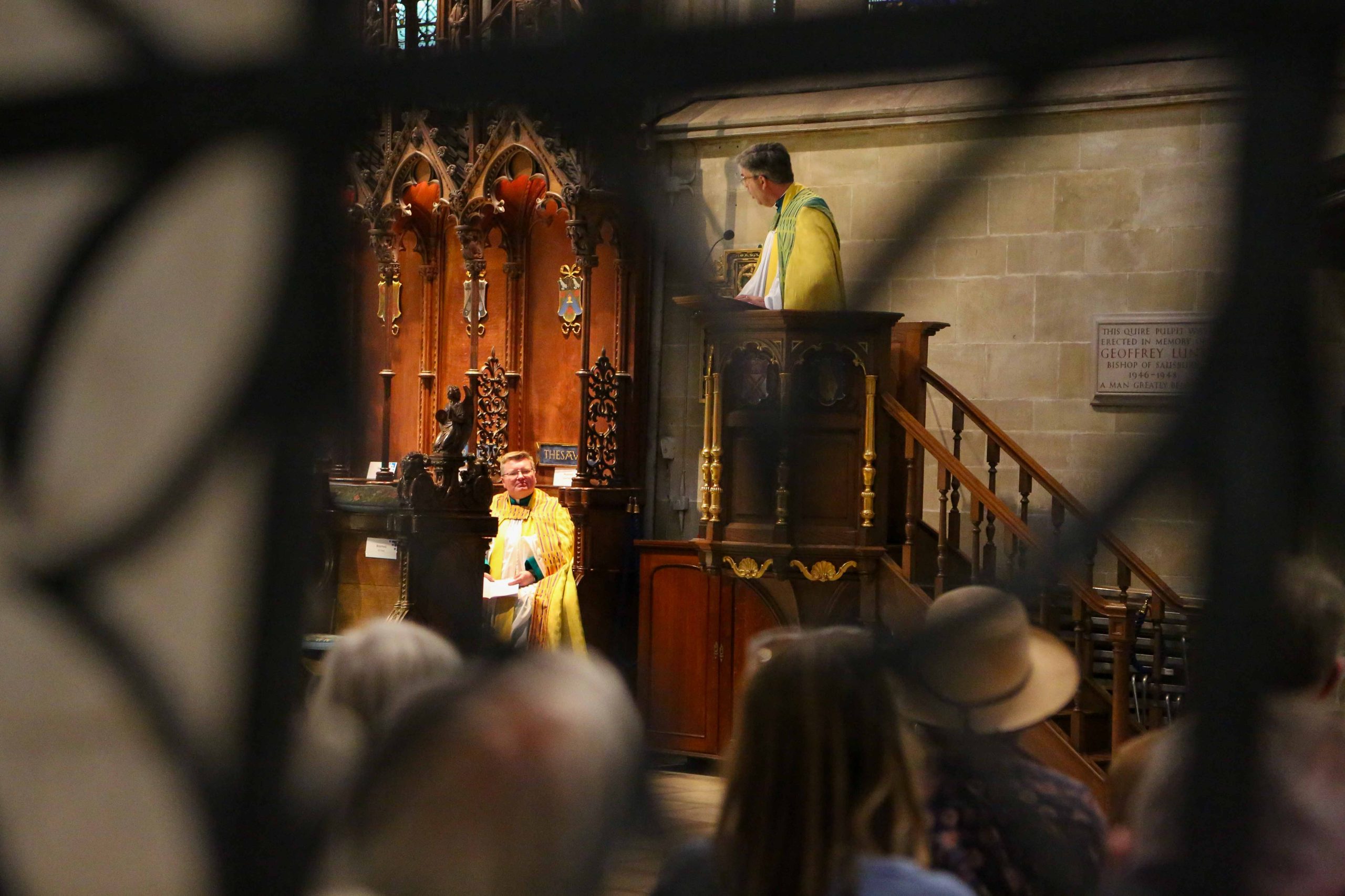 View into Quire with Dean preaching sermon from pulpit